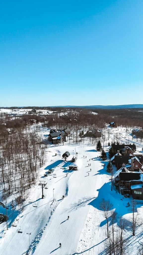 Drone view of Wisp Resort’s Ace’s High gondola run, Maryland’s only ski resort, home to Deep Creek’s largest rental chalet.